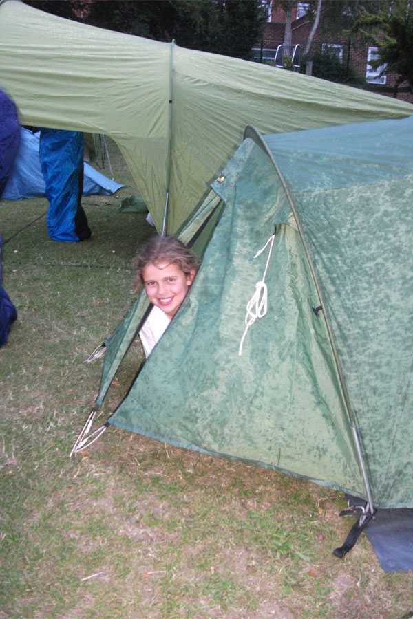 Junior school camping in tents on school trip