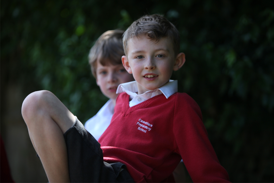 Two Caversham Prep boys sitting on the grass