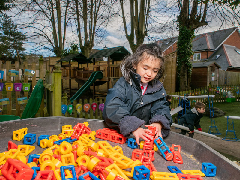 Caversham Prep pupil learning outside in the garden